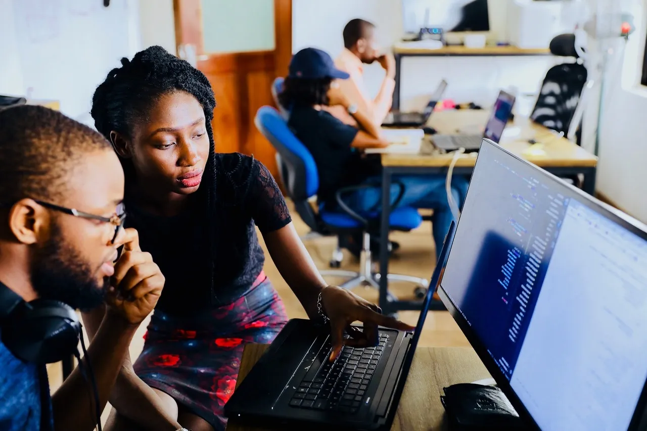 People looking at a computer screen